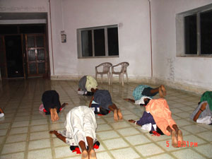Halasana (Plough Posture) being practised